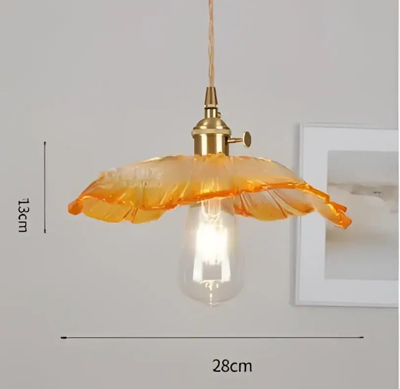 Translucent blue glass pendant light with brass fixture for dining room