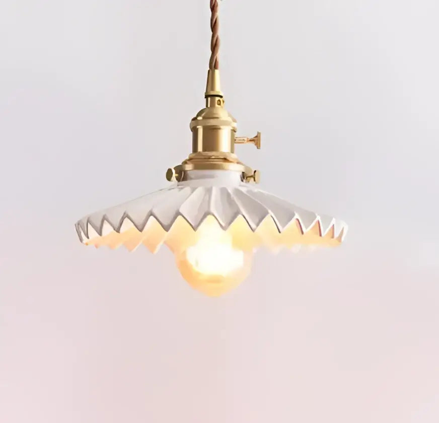 Translucent blue glass pendant light with brass fixture for dining room