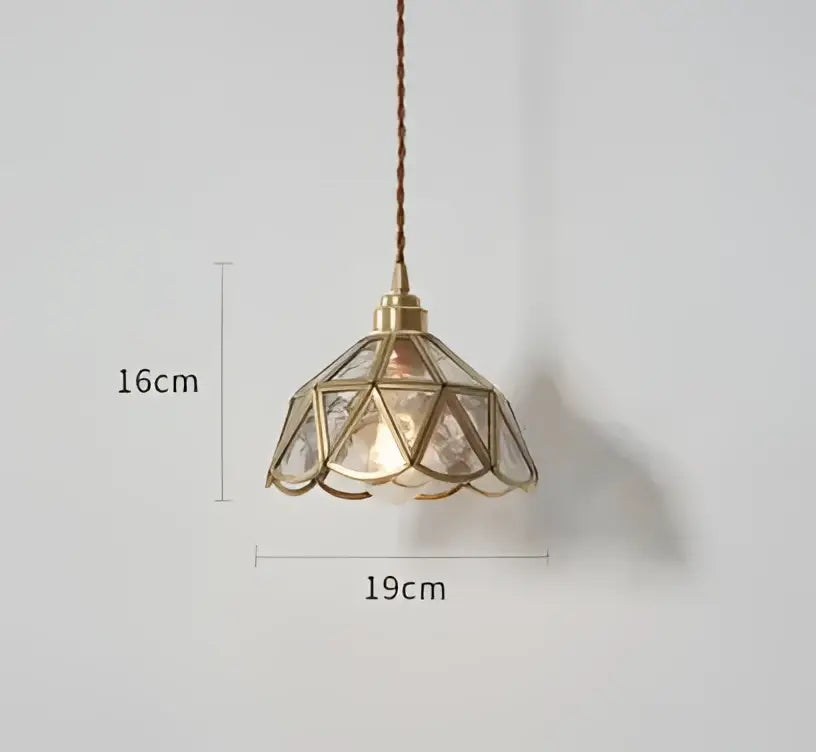 Translucent blue glass pendant light with brass fixture for dining room