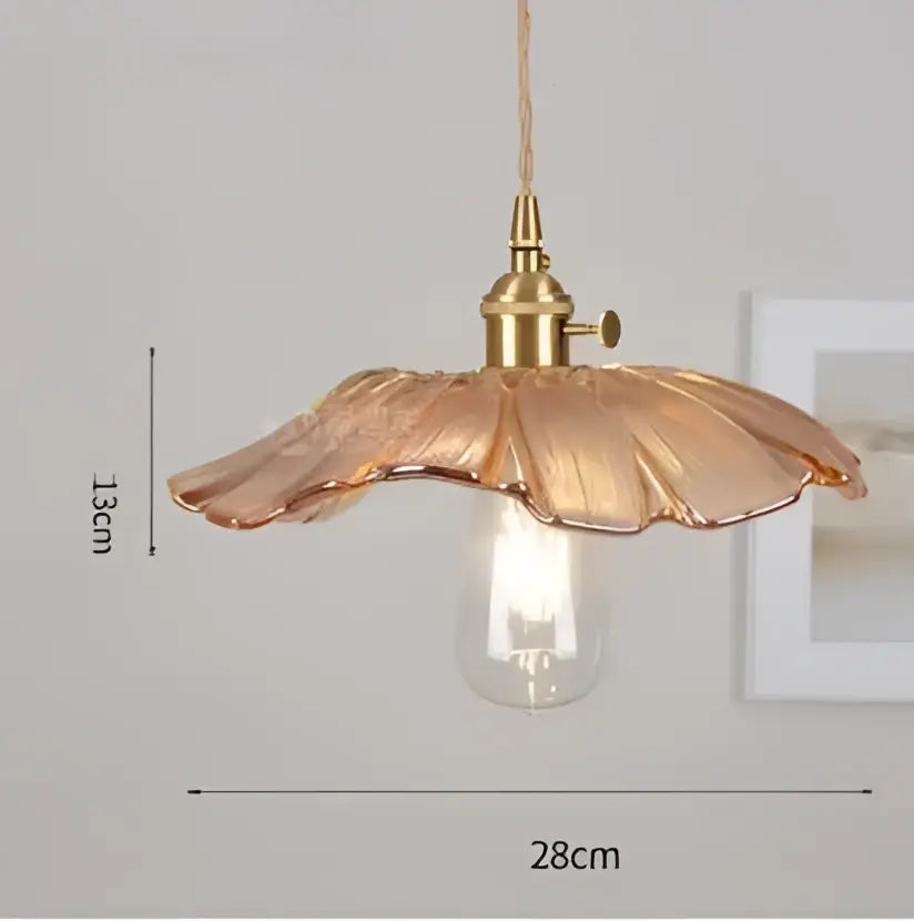 Translucent blue glass pendant light with brass fixture for dining room