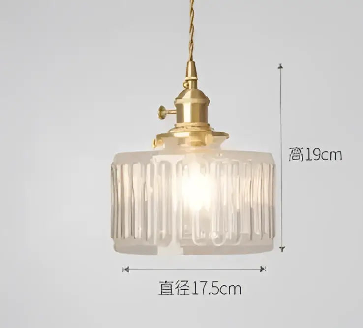 Translucent blue glass pendant light with brass fixture for dining room
