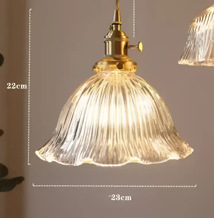 Translucent blue glass pendant light with brass fixture for dining room