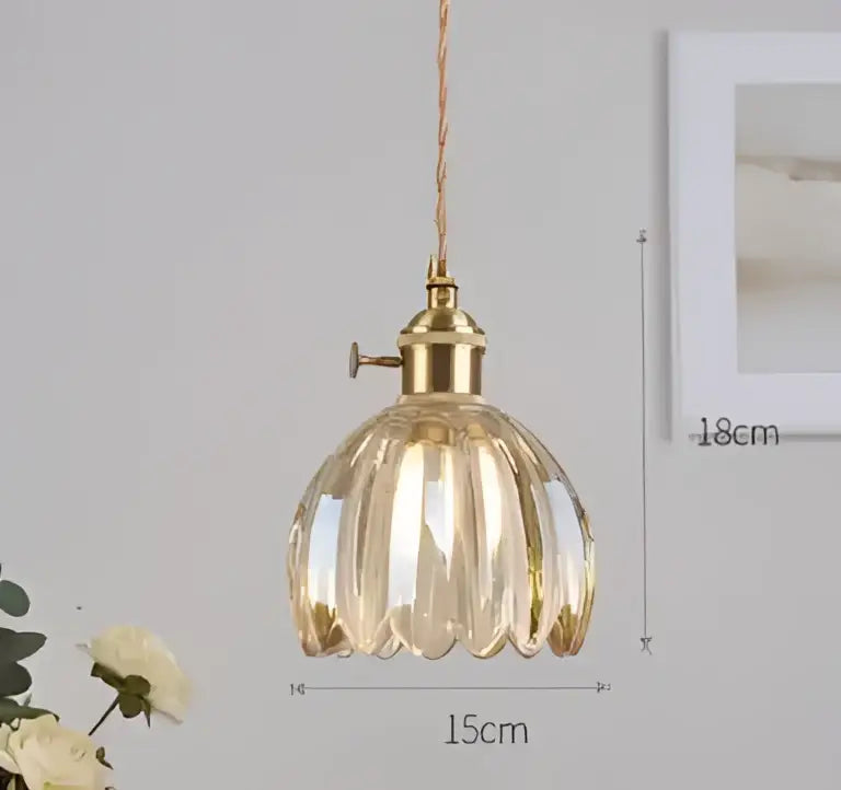 Translucent blue glass pendant light with brass fixture for dining room