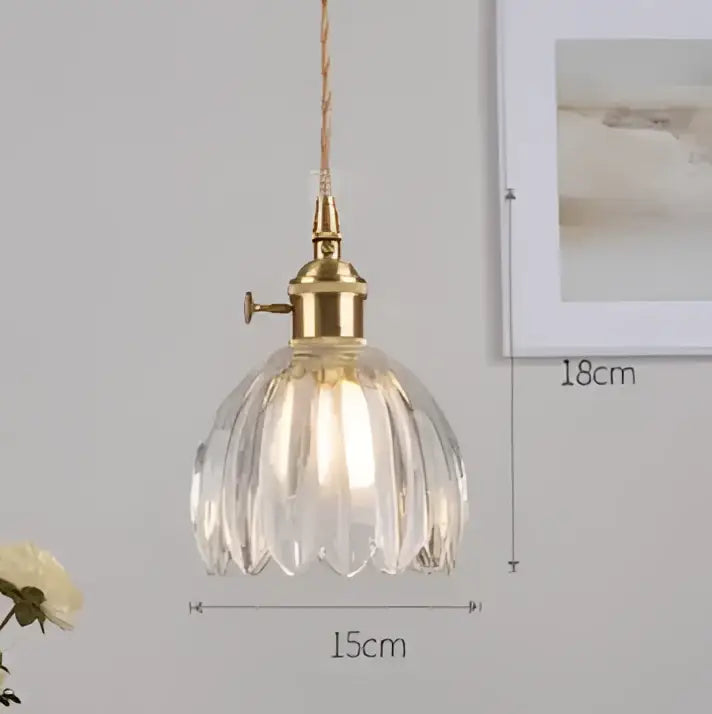 Translucent blue glass pendant light with brass fixture for dining room