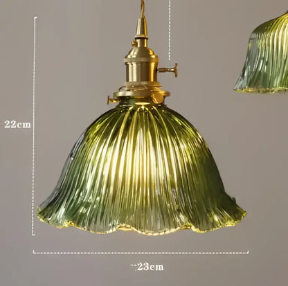 Translucent blue glass pendant light with brass fixture for dining room