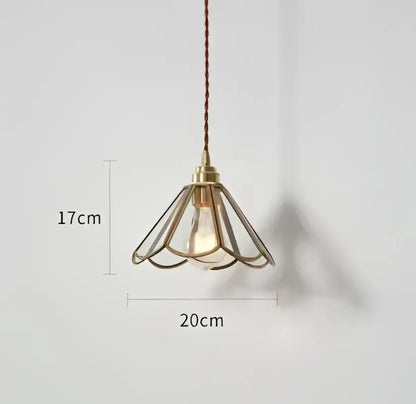 Translucent blue glass pendant light with brass fixture for dining room
