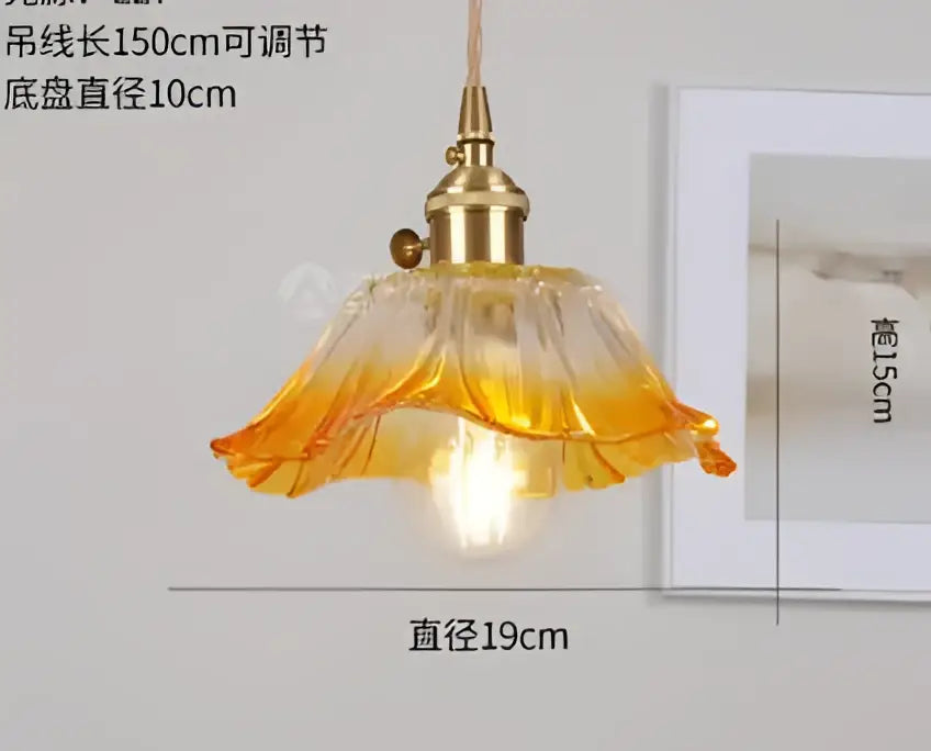 Translucent blue glass pendant light with brass fixture for dining room