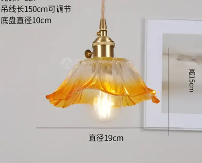 Translucent blue glass pendant light with brass fixture for dining room