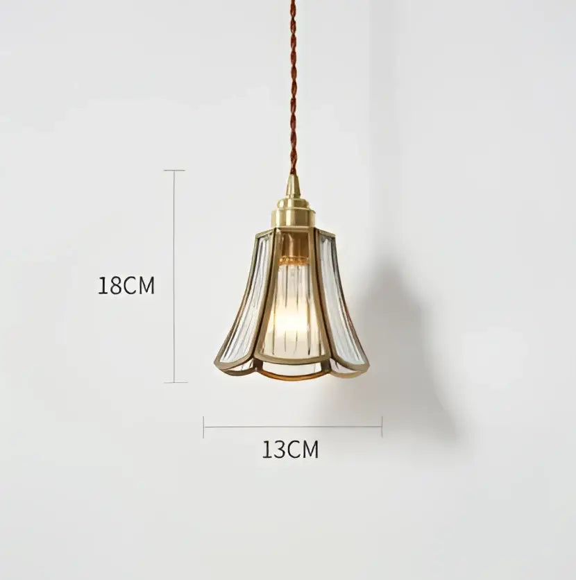 Translucent blue glass pendant light with brass fixture for dining room