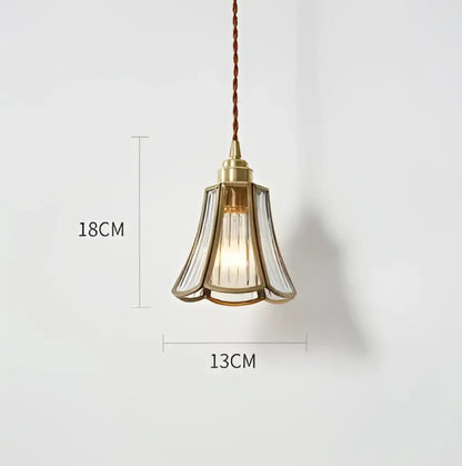 Translucent blue glass pendant light with brass fixture for dining room