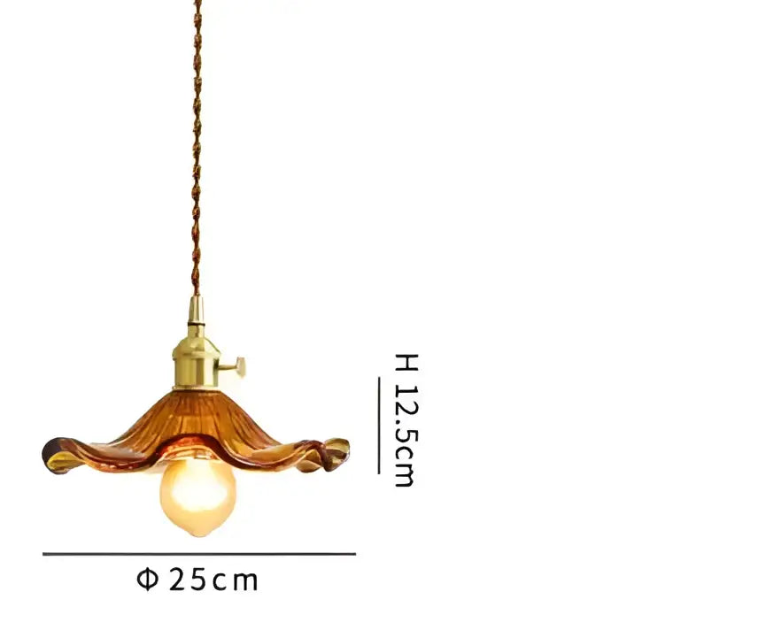 Translucent blue glass pendant light with brass fixture for dining room