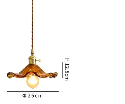 Translucent blue glass pendant light with brass fixture for dining room
