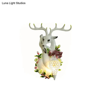 Vibrant yellow floral deer head accent crystal sconce bedroom light