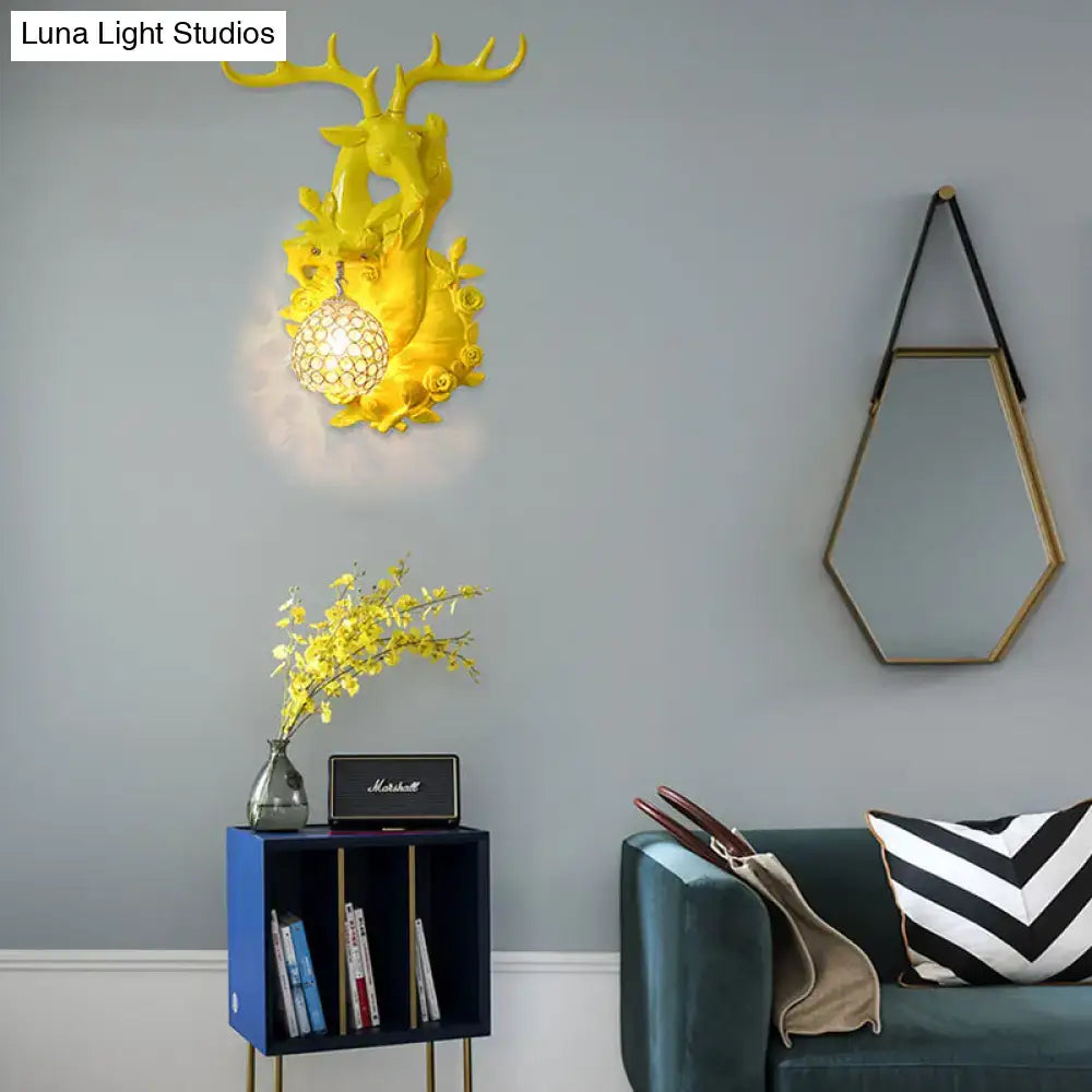 Vibrant yellow floral deer head accent crystal sconce bedroom light