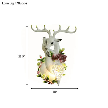 Vibrant yellow floral deer head accent crystal sconce bedroom light