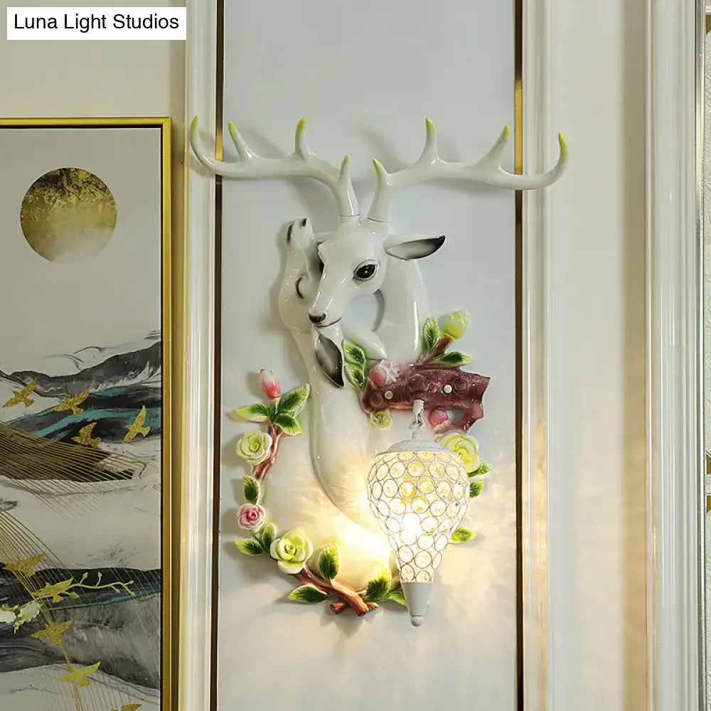 Vibrant yellow floral deer head accent crystal sconce bedroom light