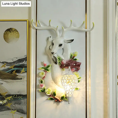 Vibrant yellow floral deer head accent crystal sconce bedroom light
