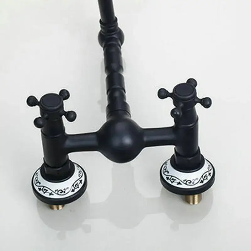 Vintage black swivel wall mounted bathroom faucet with ceramic base