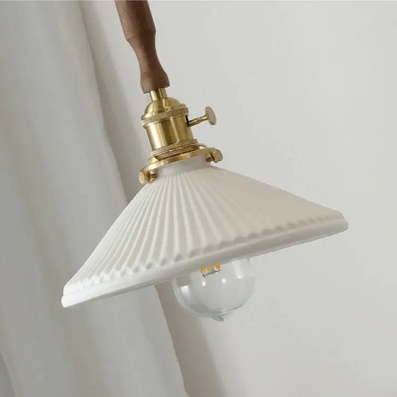 Vintage brass and ceramic walnut wood pendant light study aisle