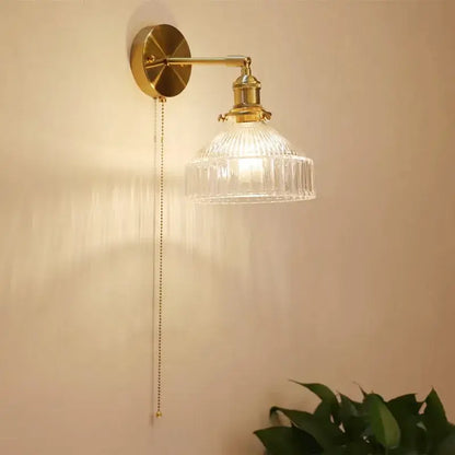 Vintage brass wall lamp with ribbed glass shade for living room