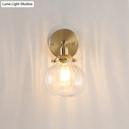 Vintage brass wall light with champagne & clear glass shade bedroom