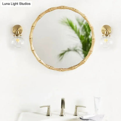 Vintage brass wall light with champagne & clear glass shade bedroom