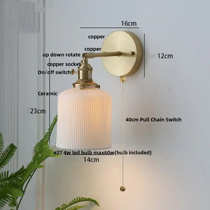 Vintage brass wall light with ribbed glass and knob switch bedroom