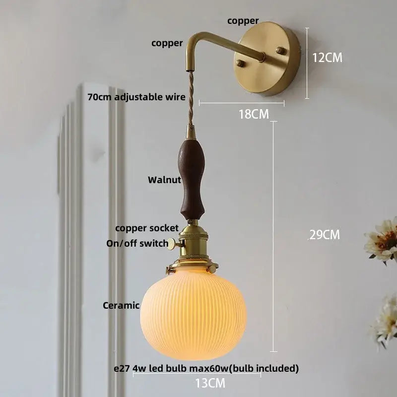 Vintage brass wall light with ribbed glass and knob switch bedroom