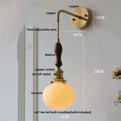 Vintage brass wall light with ribbed glass and knob switch bedroom