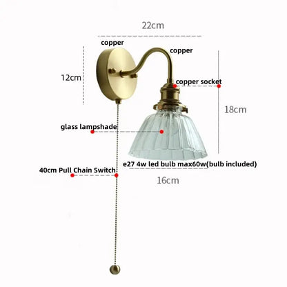 Vintage brass wall sconce with scalloped clear glass for stairways