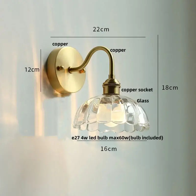 Vintage brass wall sconce with scalloped clear glass for stairways