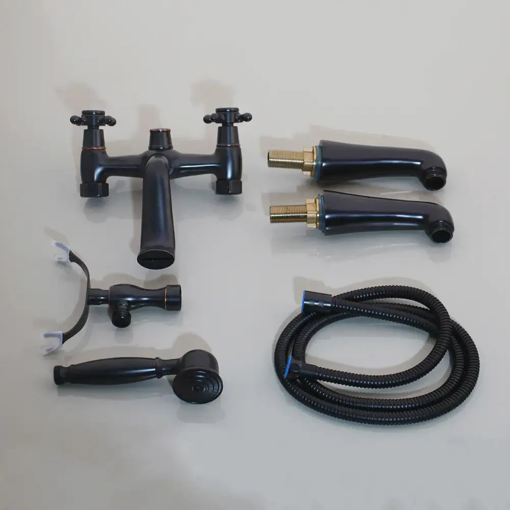 Vintage chrome bathtub faucet with dual handles and hand shower bathroom