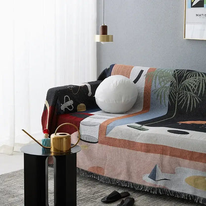 Whimsical space themed black knit sofa blanket living room decor