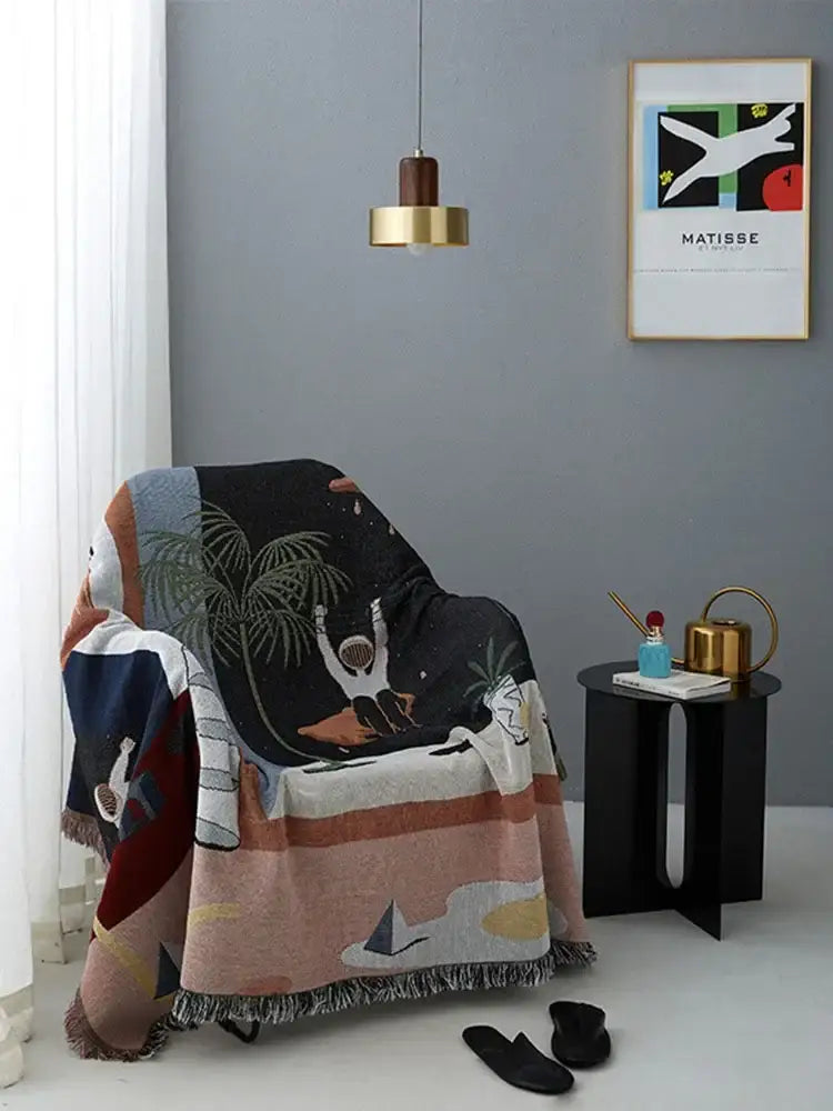 Whimsical space themed black knit sofa blanket living room decor