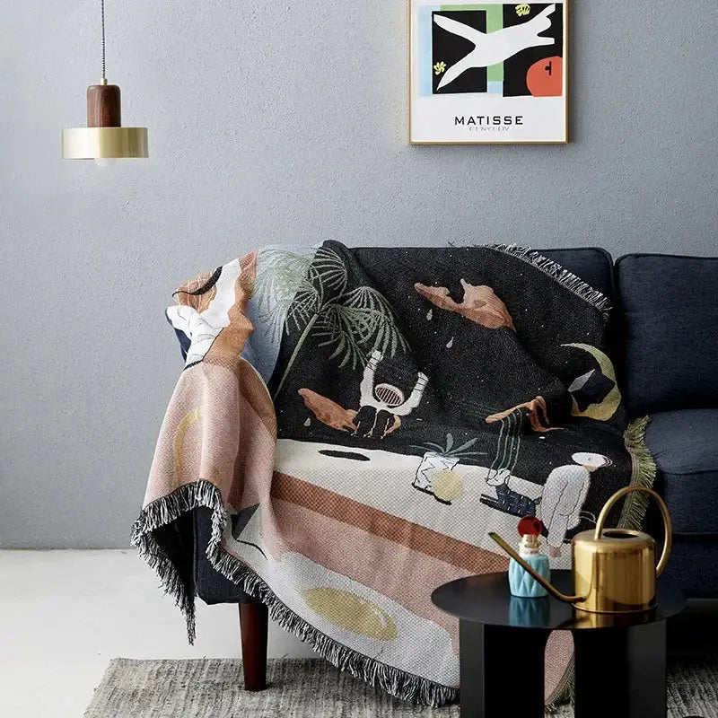 Whimsical space themed black knit sofa blanket living room decor