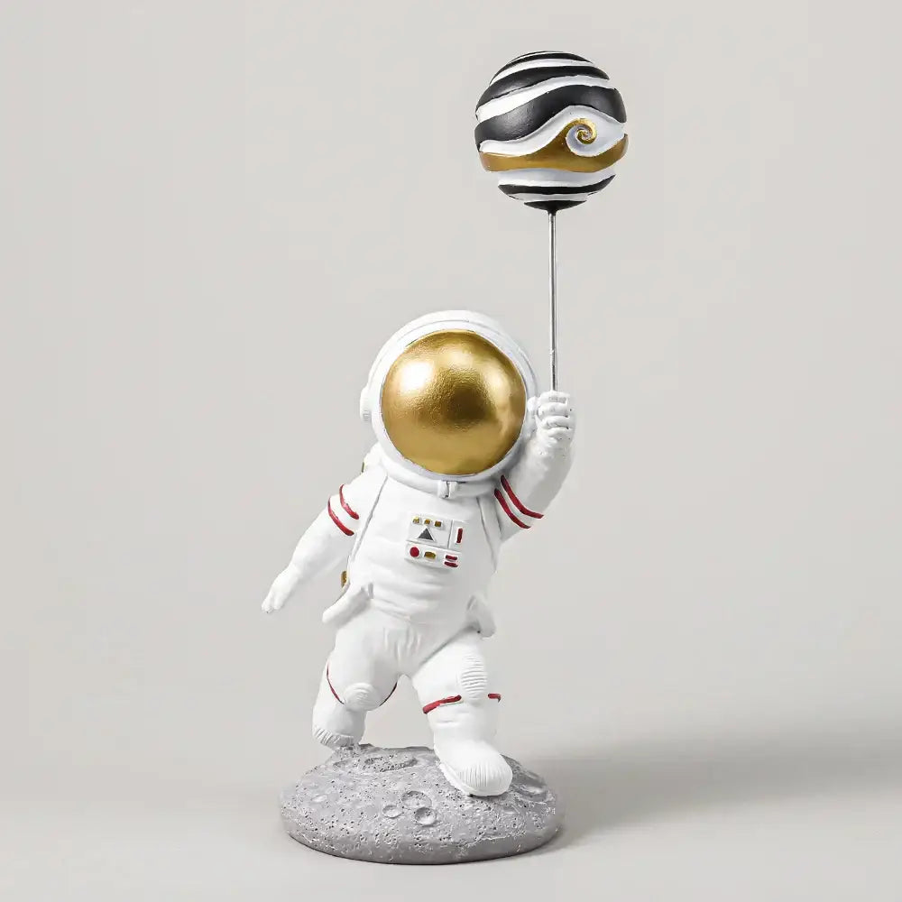 White and gold astronauts figurines with balloons living room decor
