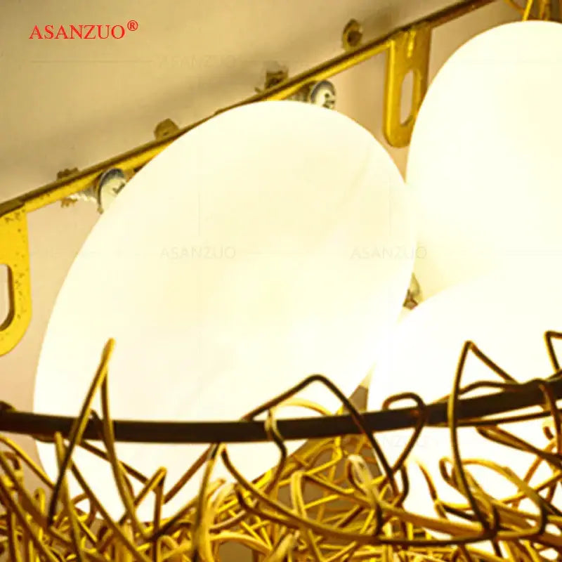 White and gold ceramic birds nest wall lamp for children room