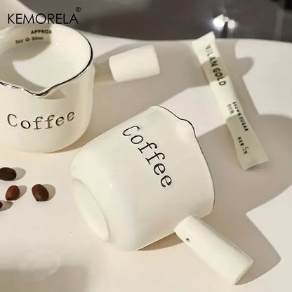 White ceramic measuring cups with silver rim – kitchen espresso tools