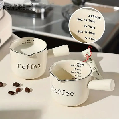 White ceramic measuring cups with silver rim – kitchen espresso tools