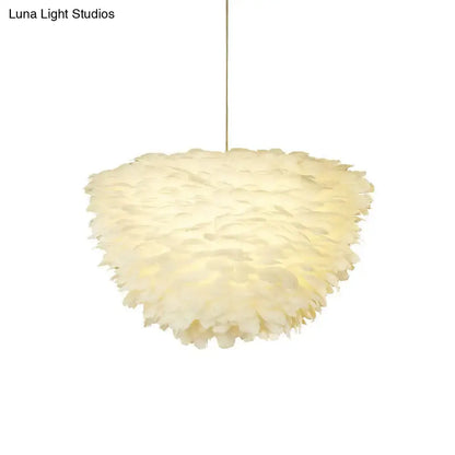 White floral pendant chandelier with feather accents for dining room