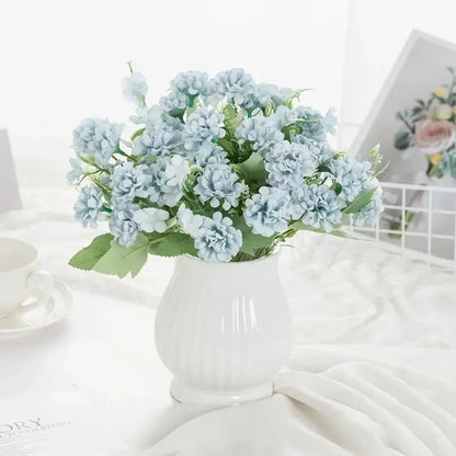 White hydrangea bouquet in ribbed glass vase for living room decor