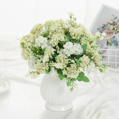 White hydrangea bouquet in ribbed glass vase for living room decor