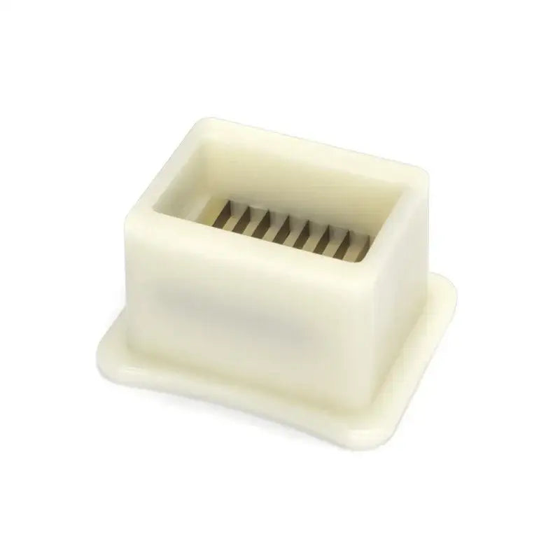 White plastic green bean slicer with metal blades kitchen shredder