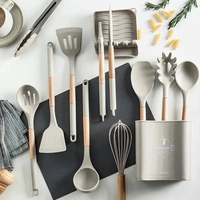 White silicone kitchen cookware set with wooden handles and holder