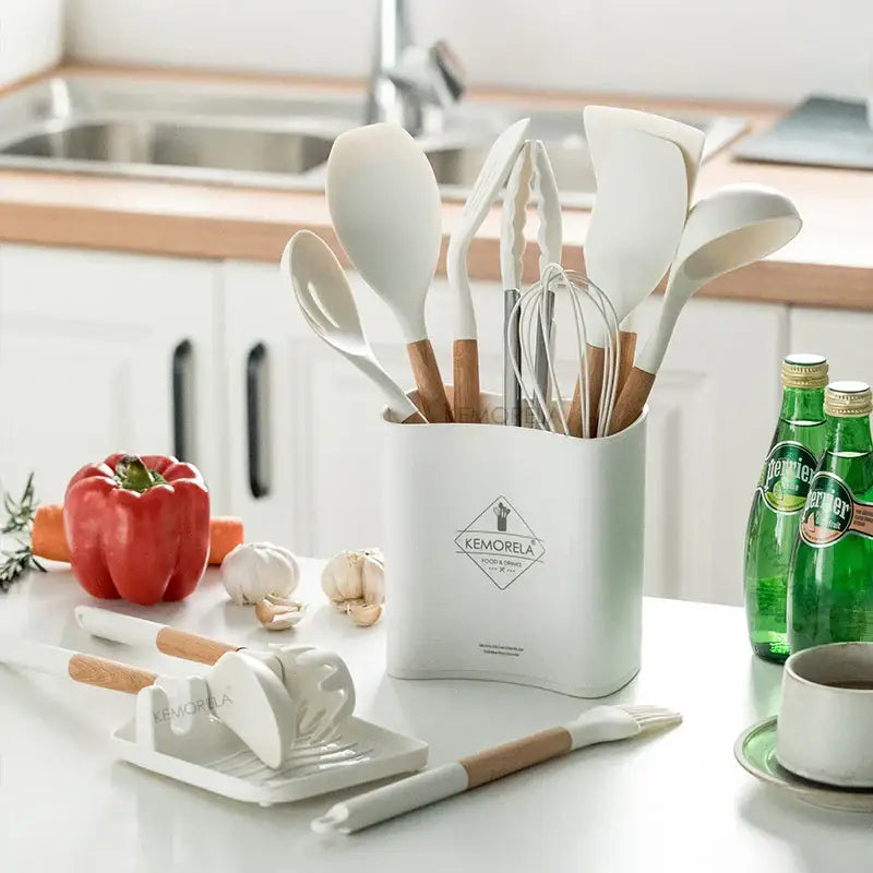 White silicone kitchen cookware set with wooden handles and holder