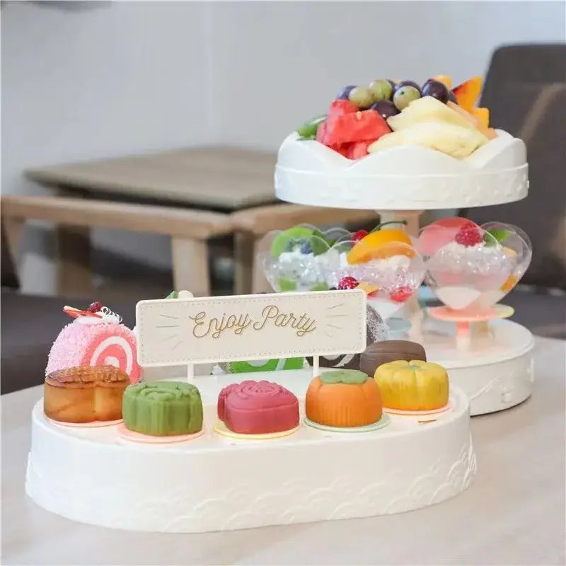 White two tiered rotating dessert table sushi machine dining room