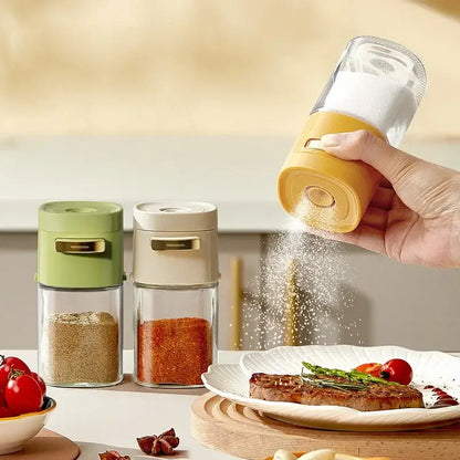 Yellow and clear glass spice dispenser kitchen salt grinder