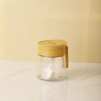 Yellow flip top glass seasoning jar with spoon kitchen spice shaker