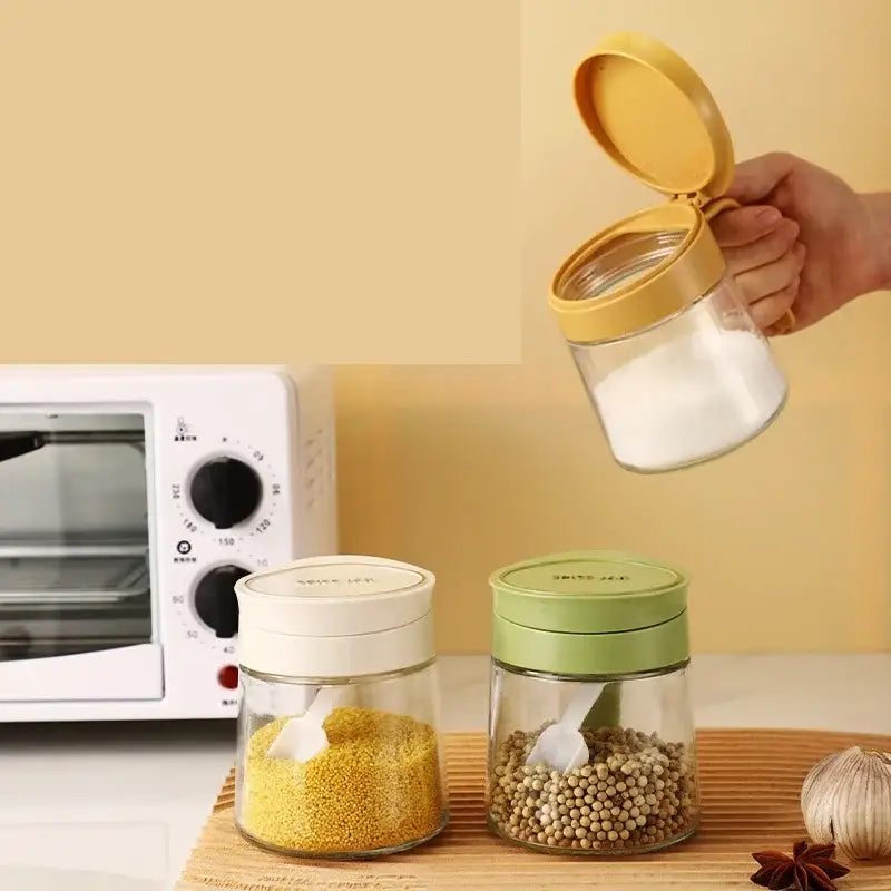 Yellow flip top glass seasoning jar with spoon kitchen spice shaker