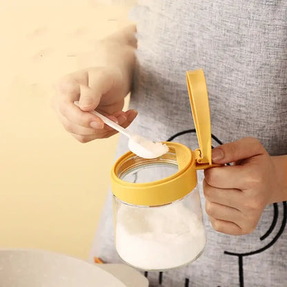 Yellow flip top glass seasoning jar with spoon kitchen spice shaker